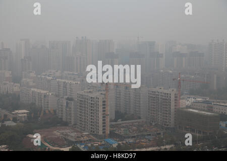 November 14, 2016 - Xi'An, Xi'an, China - Xi'an, CHINA-November 14 2016: (EDITORIAL USE ONLY. CHINA OUT).Heavy haze haunts Xi'an, capital of northwest China's Shaanxi Province, November 14th, 2016. The Xi'an Municipal Meteorological Center released a yellow alert of smoggy weather on November 13th, 2016, showing that air pollution hit Xi'an in winter again. Credit:  SIPA Asia/ZUMA Wire/Alamy Live News Stock Photo