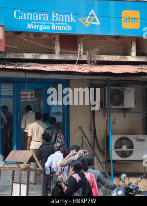 Goa, India. Monday 14th November 2016. Indians queing to get into bank branch on Margao , Goa. Banking chaos continues with long queues at any ATMs which are still open. A strict withdrawal limit of 2500 rupees ( approx £30) per day has been set for ATMs but even then many run out of cash within a few hours each day. Credit:  WansfordPhoto/Alamy Live News Stock Photo