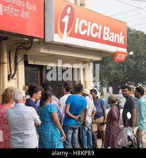 Goa, India. Monday 14th November 2016. Long queue forms outside the Varca branch if ICICI bank.Banking chaos continues with long queues at any ATMs which are still open. A strict withdrawal limit of 2500 rupees ( approx £30) per day has been set for ATMs but even then many run out of cash within a few hours each day. Credit:  WansfordPhoto/Alamy Live News Stock Photo