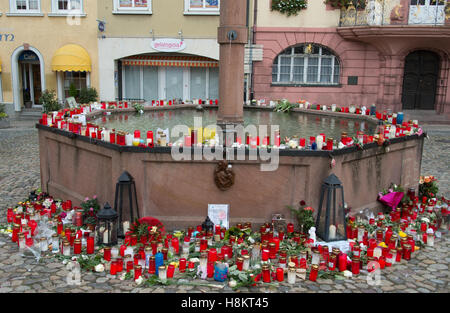 Endingen, Germany. 15th Nov, 2016. Candles and letters by the town well in Endingen, Germany, 15 November 2016. Police investigations are underway after the body of a murdered 27-year-old jogger was found in the area. Photo: Peter Seeger/dpa/Alamy Live News Stock Photo