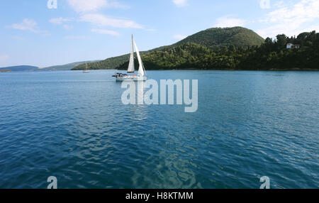 Lefkada, GREECE, May 11, 2013: Panoramic view with green islands, mountains and yacht in Ionian sea, Greece. Stock Photo