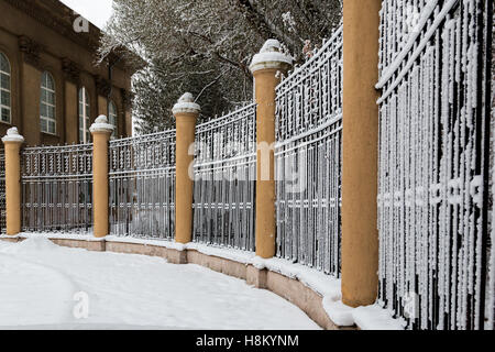 The old fence of metal bars and round pillars Stock Photo