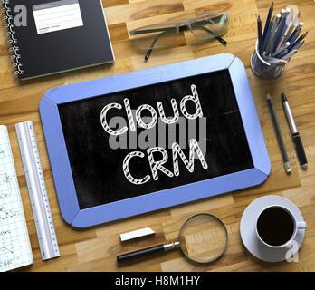 Cloud CRM Handwritten on Small Chalkboard. 3D. Stock Photo