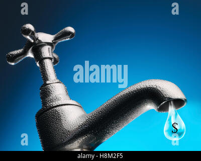 Drop of water trickling from tap close-up Stock Photo