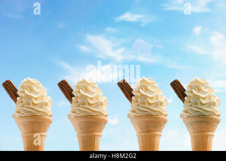 Four Ice Cream Cones against Sky Stock Photo