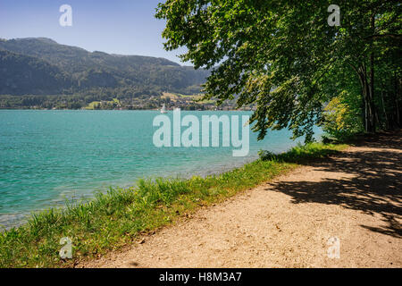 Promenade near Wolfgangsee lake and view on Sankt Gilgen village, Salzkammergut, Austria Stock Photo