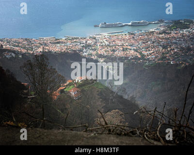 Damage from wildfires in August 2016 above the centre and port of Funchal, capital of Madeira, Portugal Stock Photo