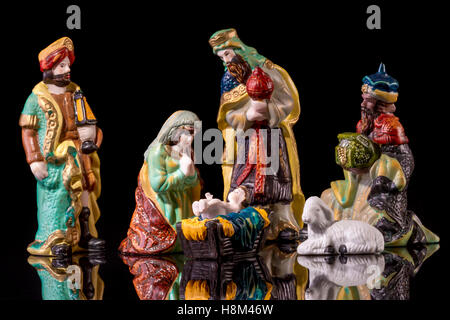 Christmas Manger scene with figurines including Jesus, Mary and magi. Focus on Mary! Stock Photo