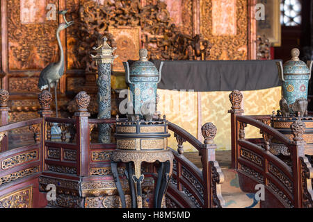 Beijing China - Close up of an ornately decorated Emperor's throne room in the Palace Museum located in the Forbidden City. Stock Photo