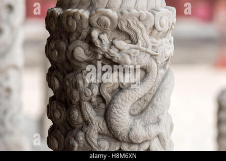 Beijing, China - Close up of a relief of a dragon in a pillar on the exterior of the Temple of Heaven, an imperial sacrificial a Stock Photo