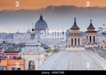 Looking over the rooftops of Rome to Saint Peter's basilica. Stock Photo