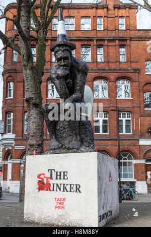 'The Drinker' a sculpture by Banksy, now amended by the artist AK47 and renamed 'The Stinker' in Shaftesbury Avenue. London. Stock Photo