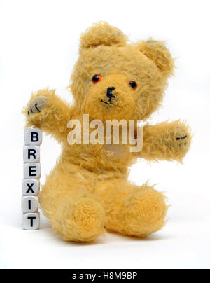 OLD TEDDY BEAR WITH WORD DICE SPELLING 'BREXIT' RE BREXIT THE EU LEAVING REFERENDUM VOTE THE EUROPEAN UNION LEAVE CAMPAIGN GB UK Stock Photo