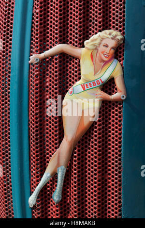 Cut-out of pin up girl tacked onto radiator grille, advertising Veedol oil, Germany Stock Photo