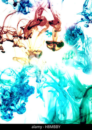 Multi-coloured substances dissolving in water Stock Photo