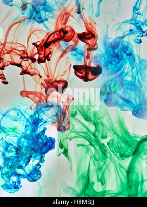 Multi-coloured substances dissolving in water Stock Photo