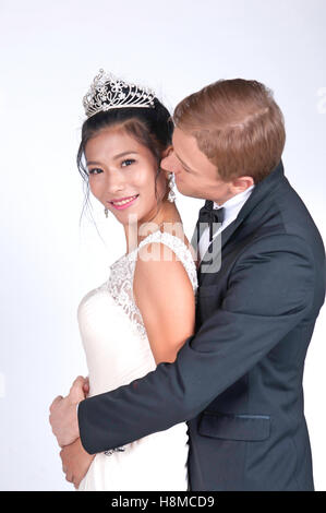 Mixed Race Bride and Groom in Studio Stock Photo