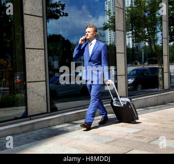 Caucasian businessman travelling making phone call Stock Photo
