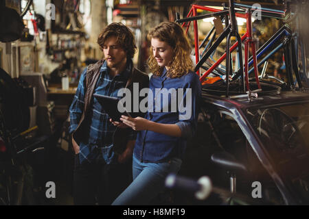 Mechanics using digital tablet Stock Photo