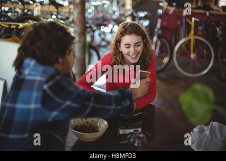 Happy couple using mobile phone Stock Photo