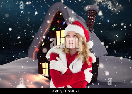 Woman in santa costume shivering with cold Stock Photo