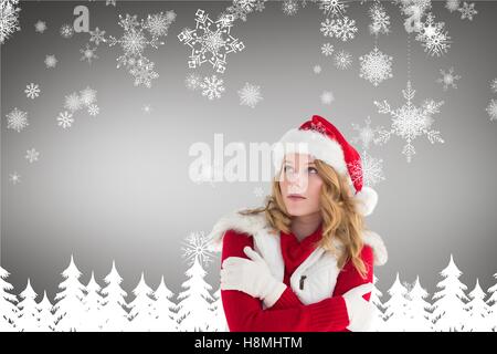 Woman in santa costume shivering with cold Stock Photo