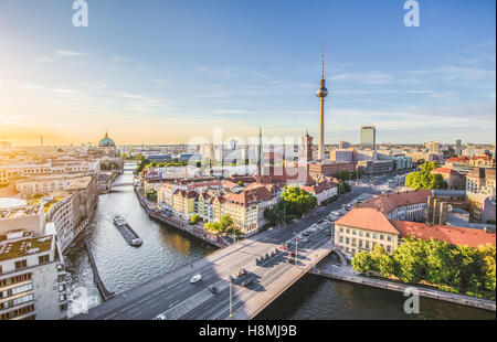 Aerial view of Berlin skyline with famous TV tower and Spree river in beautiful golden evening light at sunset, Germany Stock Photo