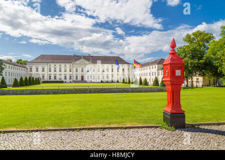 Classic view of famous Schloss Bellevue, official residence of the President of Germany, with old fire post, Berlin, Germany Stock Photo
