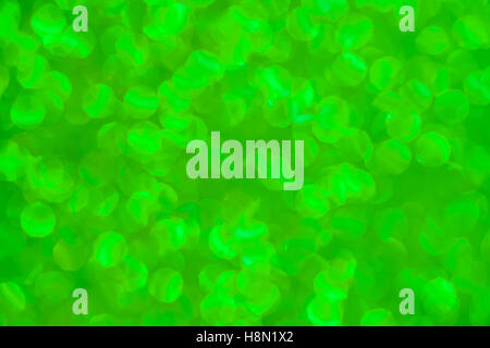 Green defocused background with blurred glitters Stock Photo
