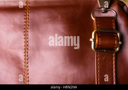 closeup of the fittings and seams on the brown leather hand bag Stock Photo