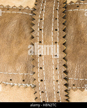 closeup of the fittings and seams on brown leather hand bag Stock Photo