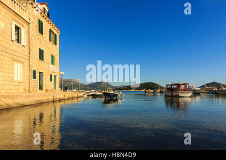 Boats in late afternoon sun in the port of Sipan Island, Elaphiti Islands, Dalmatian Coast, Croatia Stock Photo