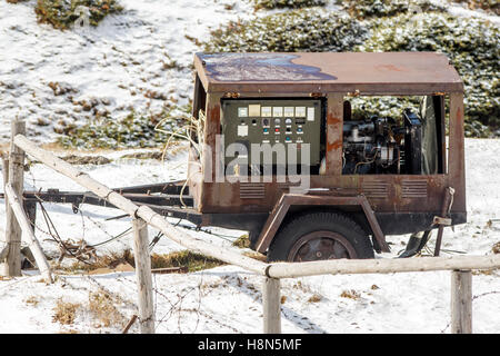 Rusty old trailer generator Stock Photo
