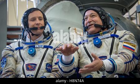 NASA International Space Station Expedition 50 backup crew members American astronaut Jack Fischer (left) and Russian cosmonaut Fyodor Yurchikhin answer press questions before their Soyuz qualification exams at the Gagarin Cosmonaut Training Center October 24, 2016 in Star City, Russia. Stock Photo