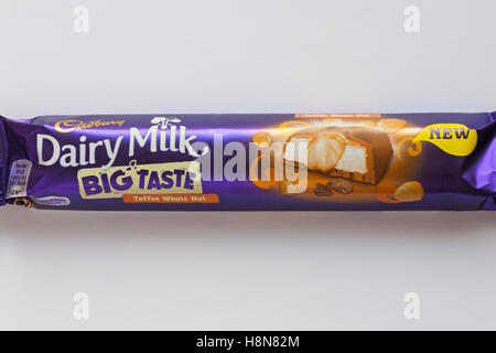 Bar of new Cadbury Dairy Milk Big Taste Toffee Whole Nut chocolate bar set on white background Stock Photo