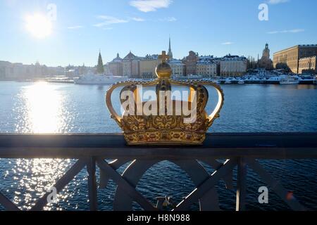 Crown on bridge across Stockholm harbor Stock Photo