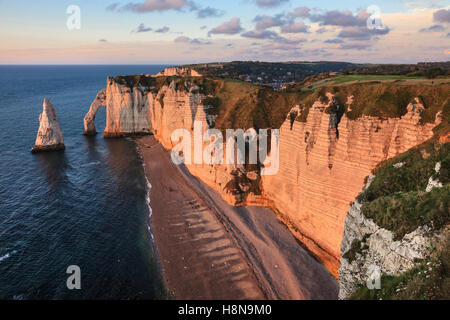 Evening light on the Aval Cliff and l'Aiguille (the Needle) at Etretat, Normandy, France Stock Photo