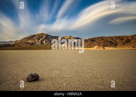 'Sailing stone'  on the The Racetrack Playa  in Death Valley National Park during golden hour. The Racetrack Playa is a scenic d Stock Photo