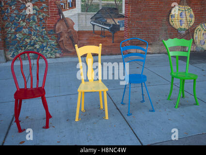 Different colored chairs as a bus stop in a small Idaho town Stock Photo