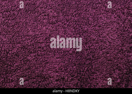 Bath towel, crimson, pink, vine, raspberry, red, natural plush terry cloth turkish beach textured fabric macro background Stock Photo