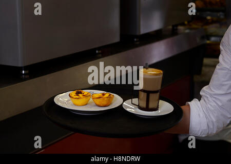 custard cakes, pasteis de nata and galao coffee Stock Photo