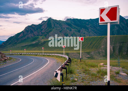 Landscape. The road in the mountains turns to the left. Ahead of breakage. Stock Photo