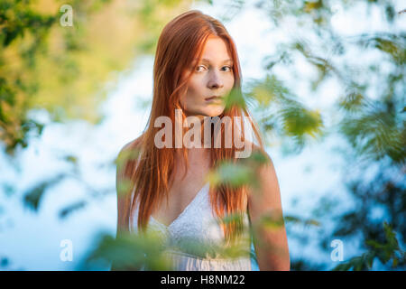 Portrait of young woman in forest