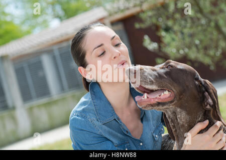 shelter keeper loves her residents Stock Photo