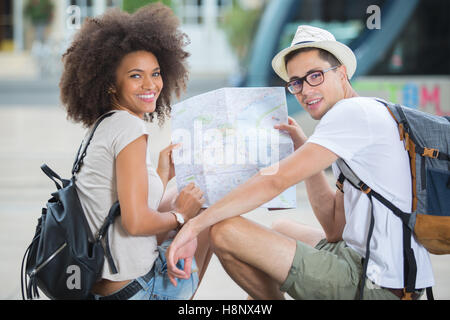 young happy couple checking a map Stock Photo