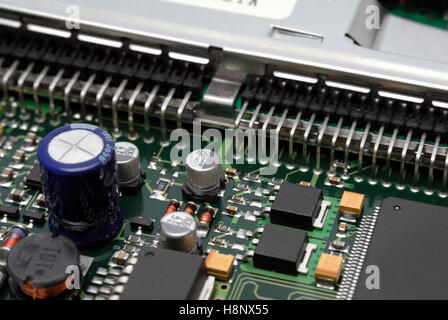 The printed-circuit-board with computer chips resistors and condensers Stock Photo