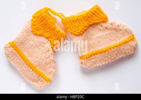 Knitted baby booties bootees isolated on white background Stock Photo