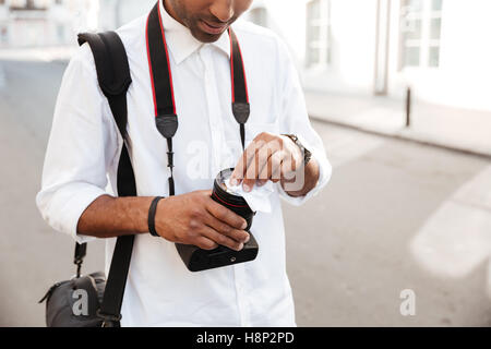 Cropped image of african photographer on the street Stock Photo