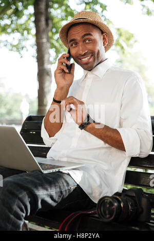 Hipster with laptop in park. close up. cropped Stock Photo