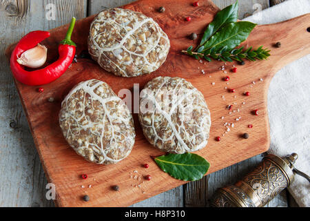 Caul-Fat Meatballs raw burger cutlet handmade on desk Stock Photo